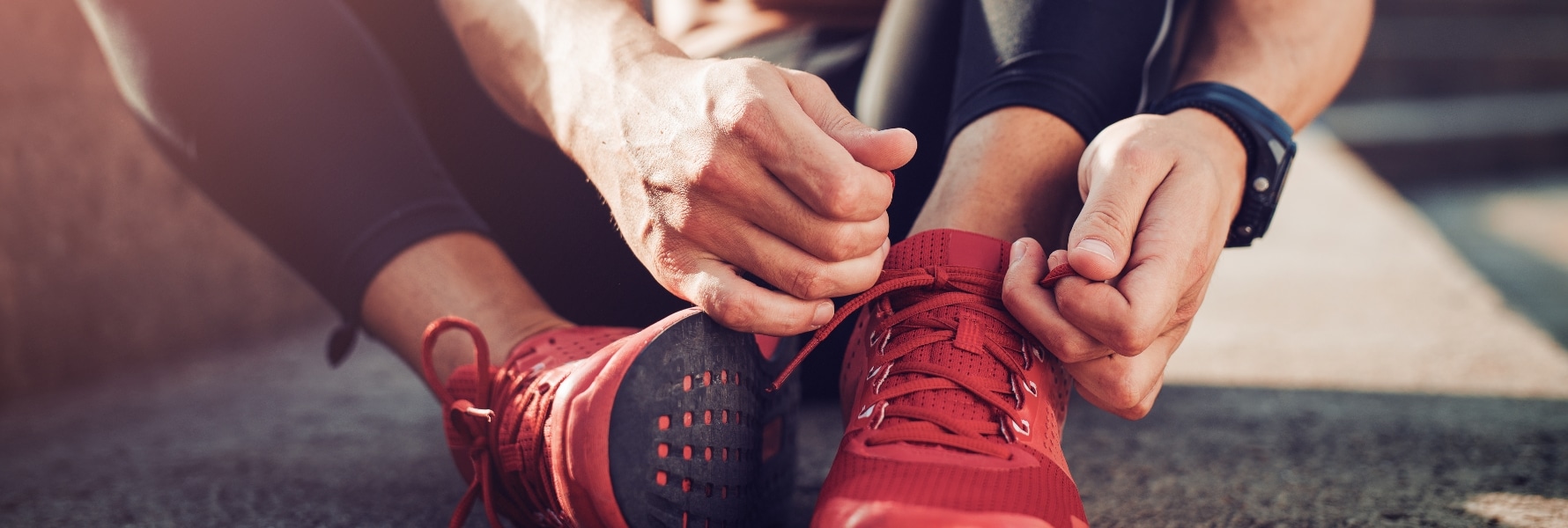 closeup image of someone tying their shoes