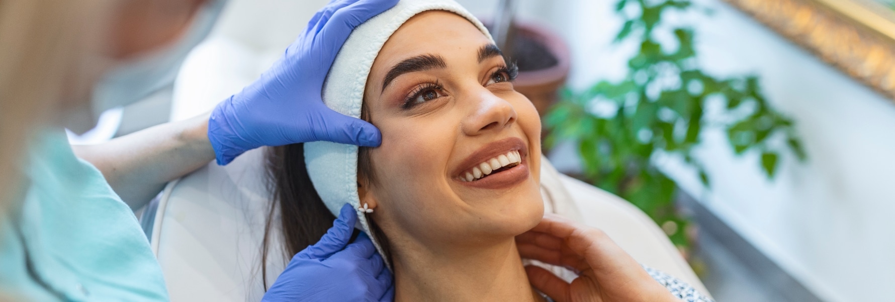 closeup image of young woman getting medical dermatology treatment